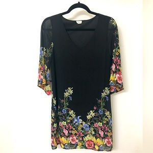 Black mini dress with floral detailing and optional fabric wrap belt.